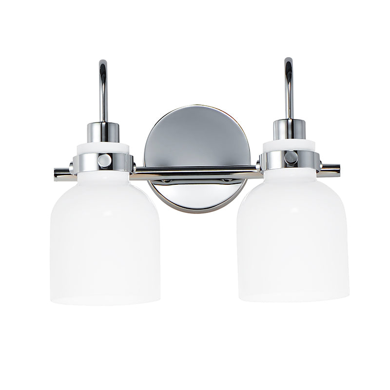 a wall-mounted light fixture with two white glass shades and a silver metal frame